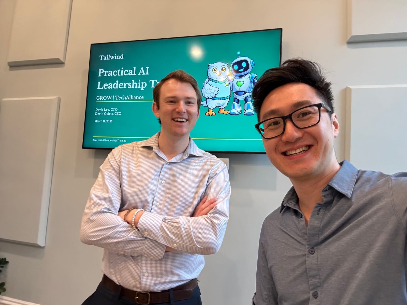 Devin Golets and Davie Lee in front of the title slide for a Practical AI Leadership Training session with TechAlliance
